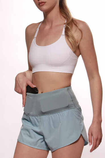 Women's Concealed Carry Runners Shorts from Alexo in light blue with horizontal phone pocket